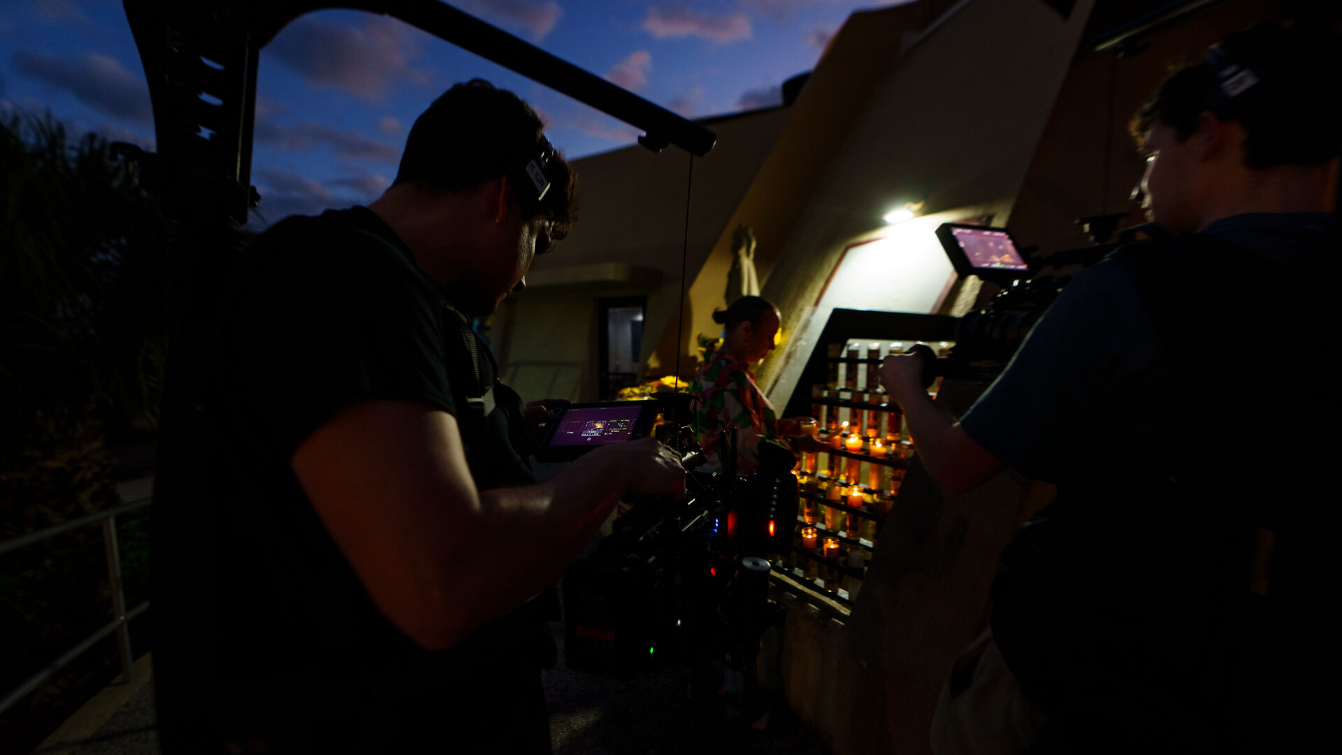 Director framing a shot during late afternoon light