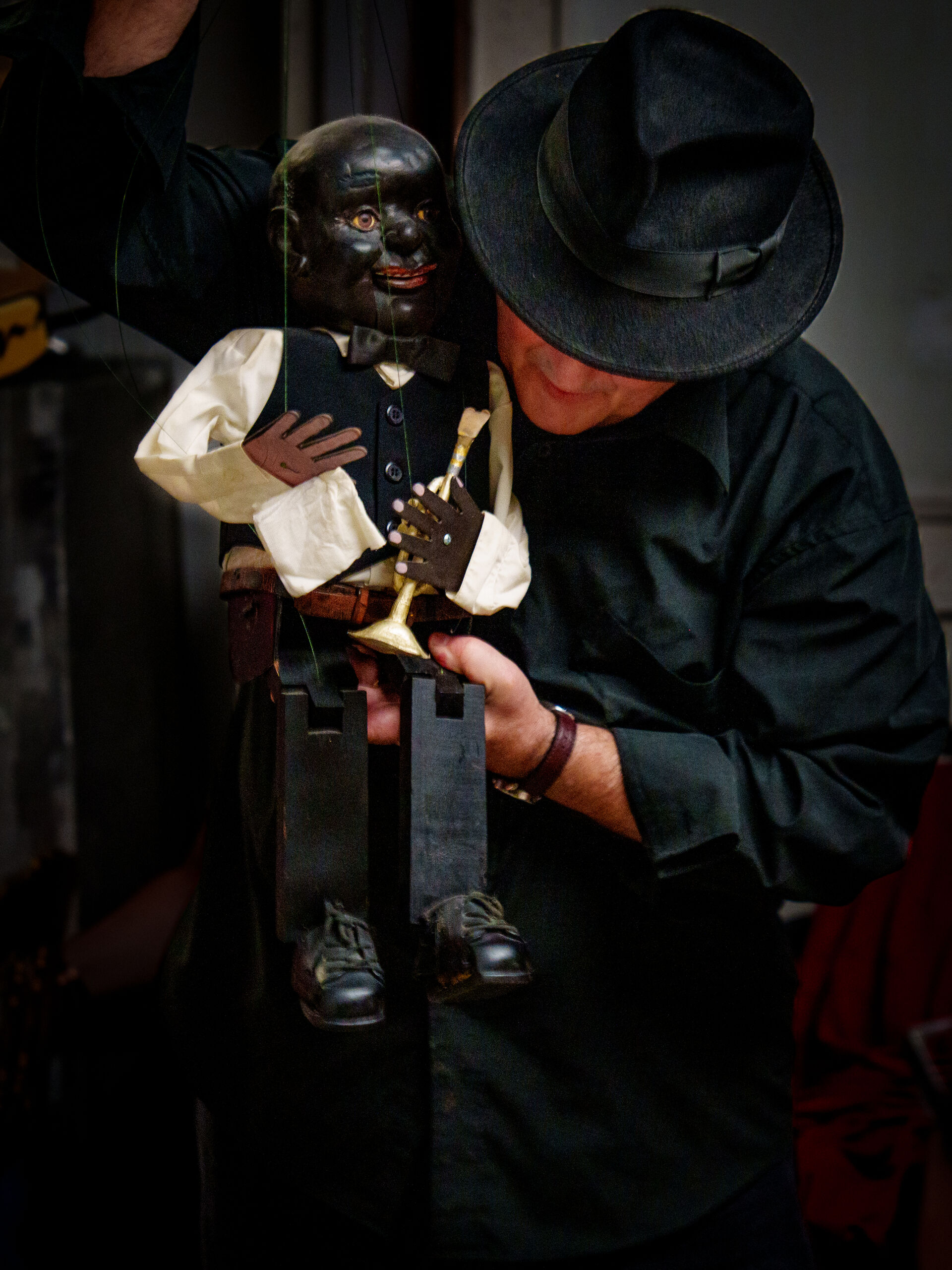 Puppeteer with handcrafted marionette