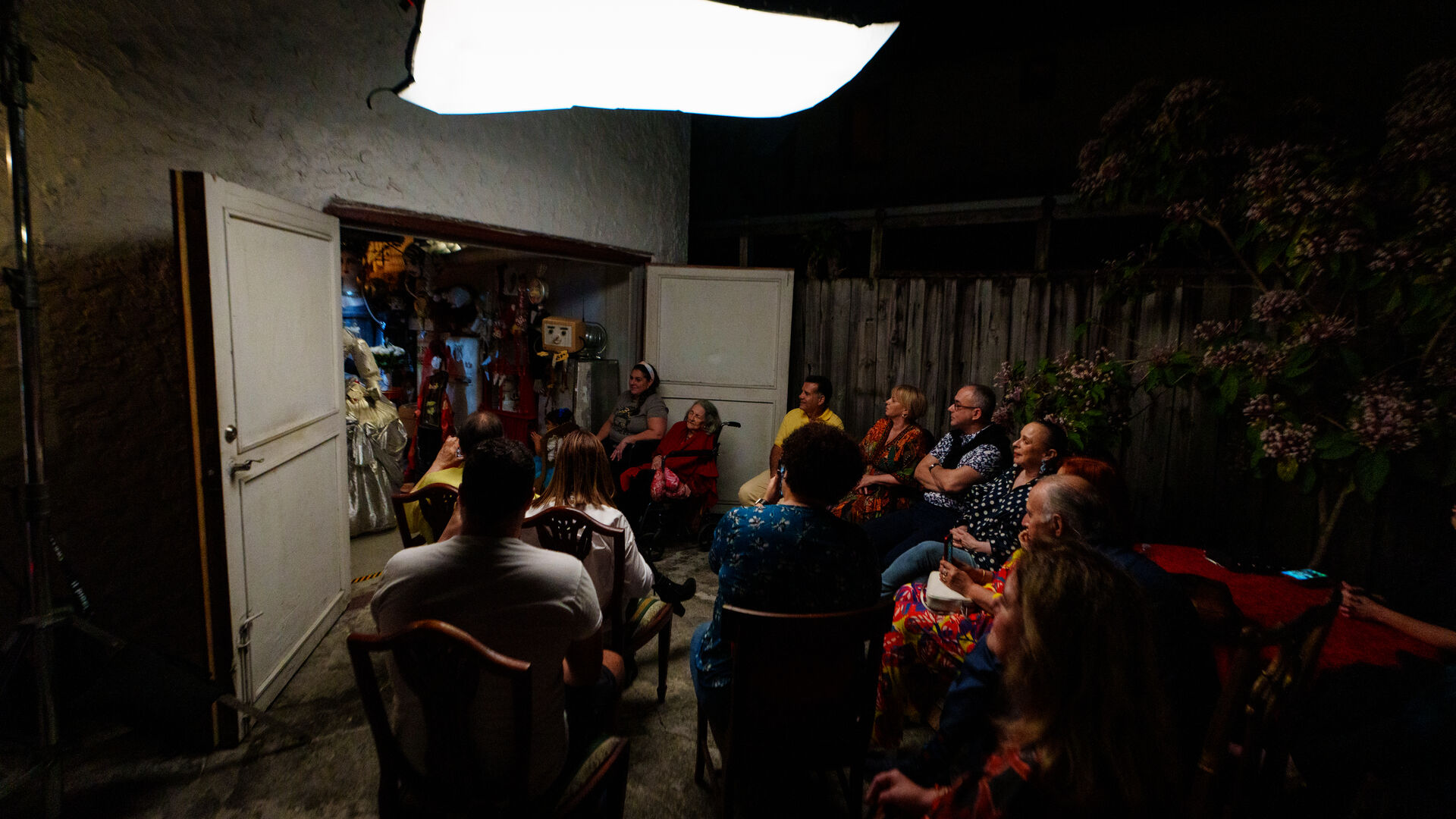 Crew adjusting lighting for an interview setup