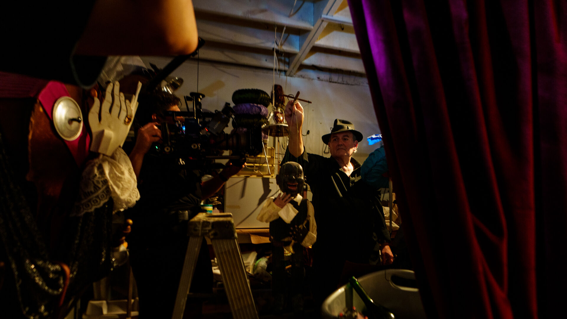 Backstage at puppet theater with filmmaker
