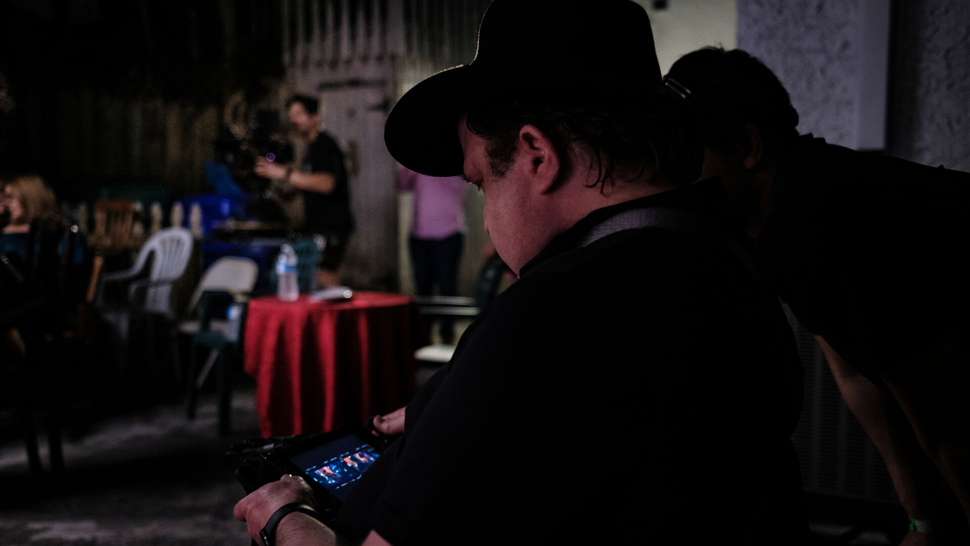Director reviewing footage on monitor between takes